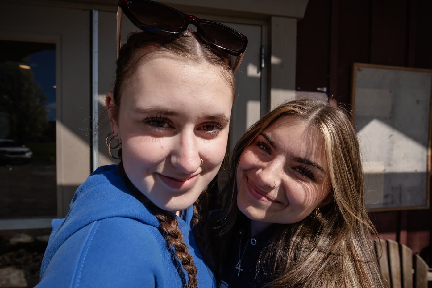 Two friends smiling in the sun